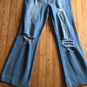 flared blue baggy ripped jeans